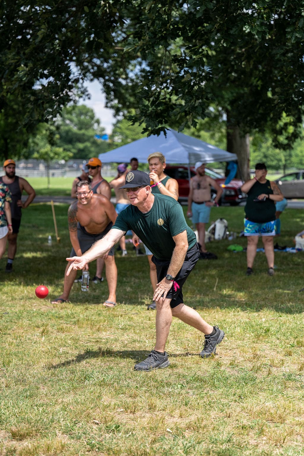 Bocce player throwing ball.
